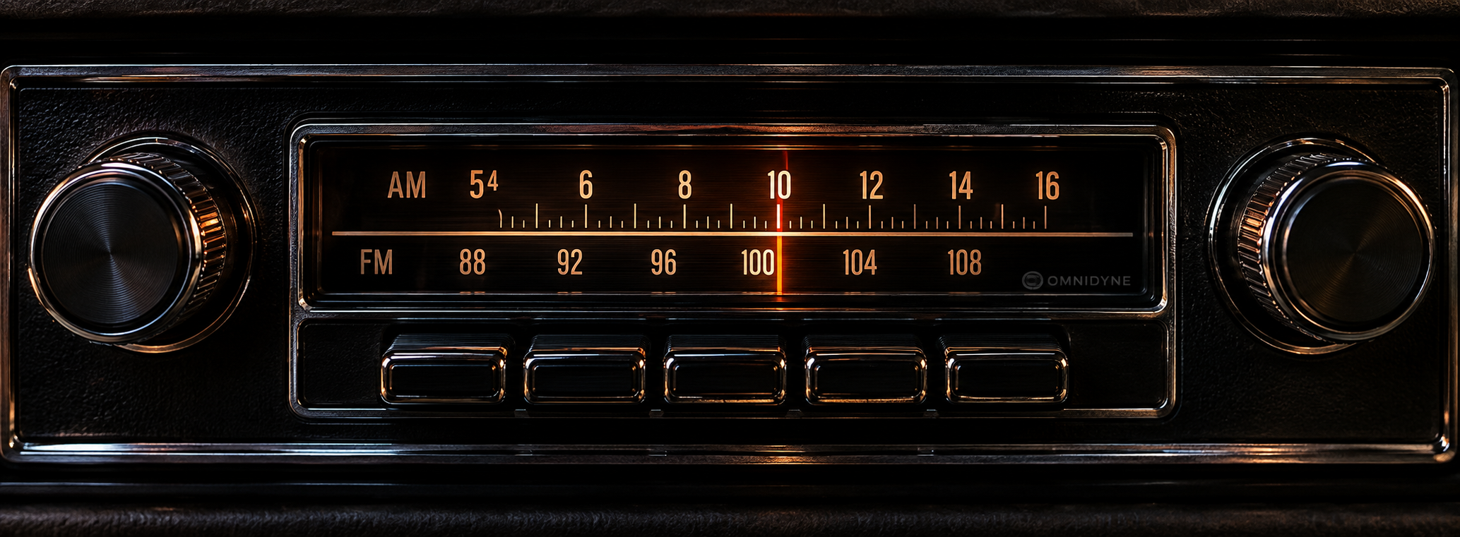 Blacked-out vintage OmniDyne car radio with chrome trim